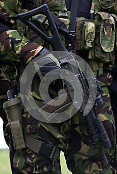Army and police combat uniform with autorifle