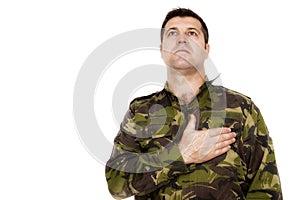 Army soldier swear solemnly with hand on heart