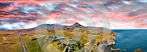 Arnarstapi coastline in sumemr season, Snaefellsnes peninsula, Iceland. Panoramic aerial view from drone at sunset photo