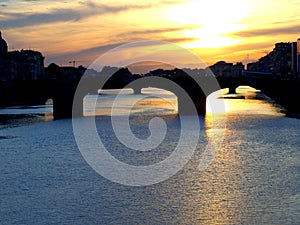The Arno river in Florence at the sunset