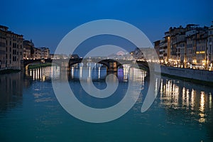 Arno River, view from Ponte Vecchio after Sunset, Reflections of Lights, Colours and the Ferris Wheel in Florence, Italy