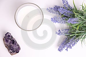 Aroma candle in glass with lavender flowers and amethyst