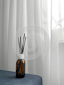 Aroma diffuser on the background of a window, space for text.