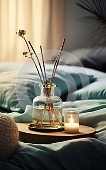 Aroma diffuser perfume and candles. Cozy home decor and aromatherapy. Relaxing atmosphere for joga or hygge lifestyle