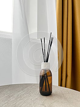 Aroma diffuser on the table, against the background of the window, space for text.