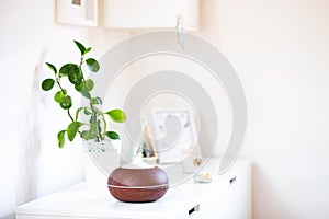 aroma oil diffuser on table at home. Air freshener