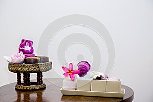 Aroma oil, facial cream, powder, towel on table