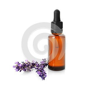 Aroma oil and lavender flowers isolated on white