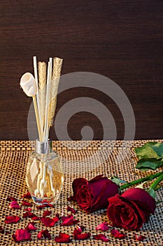Aroma reed diffuser on wood pattern background