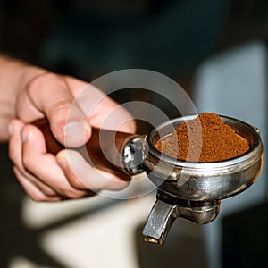 Aroma to kick start and energise your day. Barista brews espresso coffee in cafe. Coffee making in coffeehouse. Brewing photo