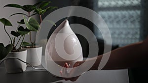 Aromatherapy air humidifier of modern design works indoors maintaining a comfortable microclimate