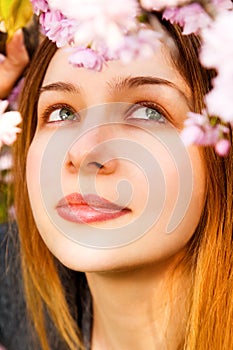 Aromatherapy - beautiful woman smelling flowers