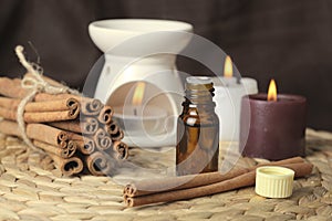 Aromatherapy - candles and cinnamon photo