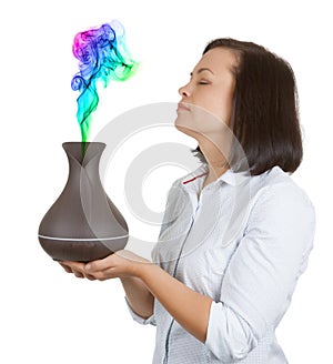 Aromatherapy Concept. Beautiful Woman Smelling Color Steam from