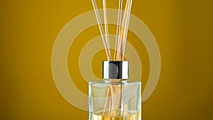 Aromatherapy diffuser, home perfume concept, reed diffuser rotate on background