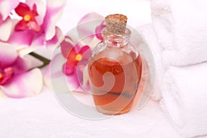 Aromatherapy oils, orchid and towels