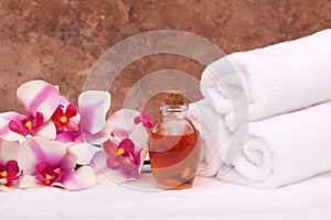 Aromatherapy oils, orchid and towels