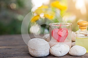 Aromatherapy product spa of therapy massage with plumeria or frangipani flowers, stones, aroma candle and oil on the desk,Spa