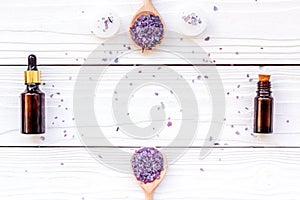 Aromatherapy for relax concept. Lavender branch, spa salt, oil and candles on white background top view copyspace