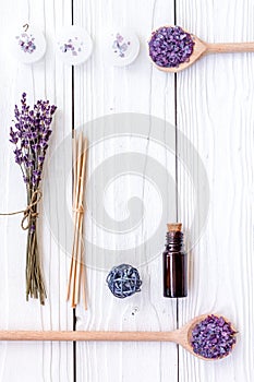 Aromatherapy for relax concept. Lavender branch, spa salt, oil and candles on white background top view copyspace