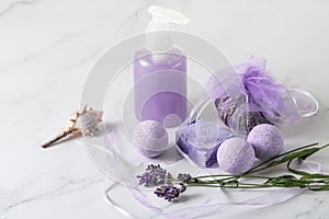 Aromatherapy set with lavender flowers for bath relaxation and body care.  Shampoo bottle, soap and bombs with lavender extract,