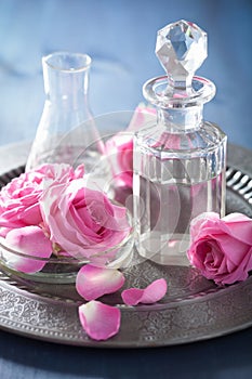 Aromatherapy set with rose flowers and flasks