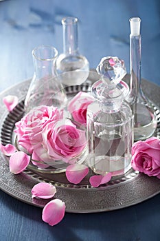 Aromatherapy set with rose flowers and flasks