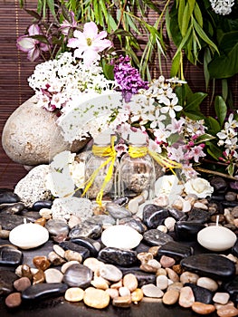 Aromatherapy, spa, beauty treatment and wellness background with massage stone, flowers, burning candles... spa concept