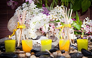 Aromatherapy, spa, beauty treatment and wellness background with massage stone, flowers, burning candles... spa concept