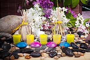 Aromatherapy, spa, beauty treatment and wellness background with massage stone, flowers, burning candles... spa concept