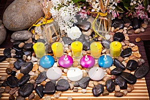 Aromatherapy  spa  beauty treatment and wellness background with massage stone  flowers  burning candles... spa concept