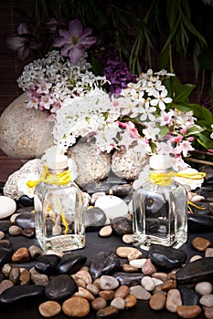 Aromatherapy, spa, beauty treatment and wellness background with massage stone, flowers, burning candles... spa concept