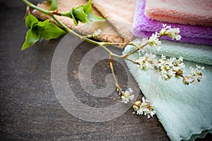 Aromatherapy spa set. stack folded towel with flowers