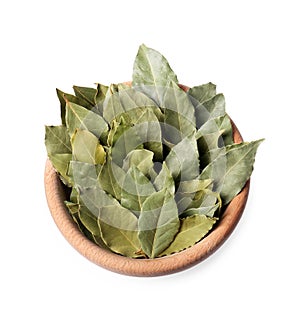 Aromatic bay leaves in wooden bowl on white background, top view