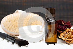 Aromatic botanical cosmetics. Dried herbs flowers mixture, body scrub brush, oils. Holistic herbal DIY skincare beauty hack