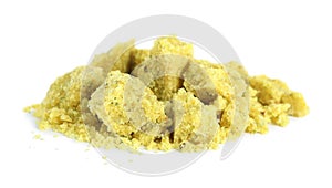 Aromatic crumbled bouillon cube on white background