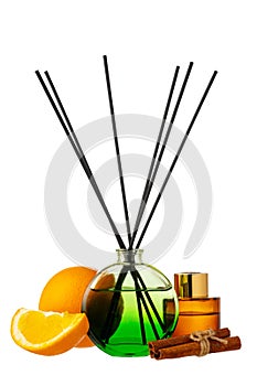 Aromatic diffuser with orange and cinnamon scent on white background