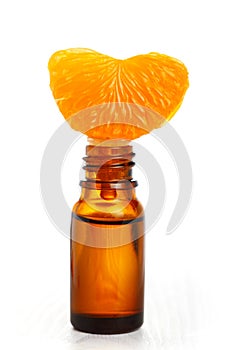 Aromatic essence oil and fresh orange segment