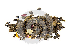 Aromatic green dried tea leaves with mango isolated on the white background