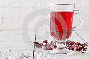 Aromatic Hibiscus tea on white table