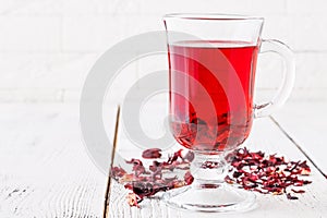 Aromatic Hibiscus tea on white table