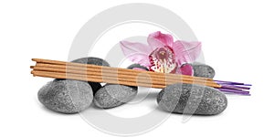 Aromatic incense sticks, spa stones and orchid flower on white background