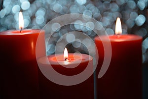 Aromatic orange candle, bokeh background