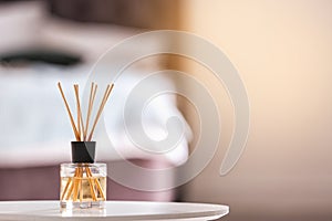 Aromatic reed air freshener on table