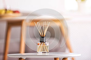 Aromatic reed air freshener on table