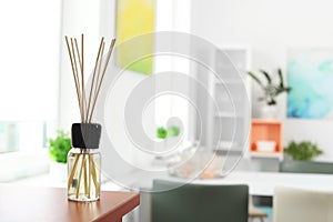 Aromatic reed air freshener on table