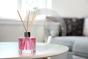 Aromatic reed air freshener on table