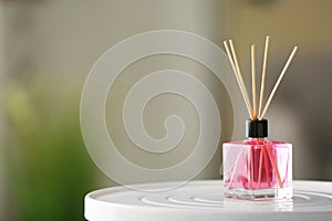 Aromatic reed air freshener on table