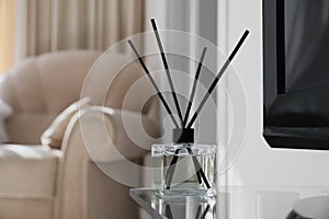 Aromatic reed air freshener on tv table indoors