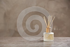 Aromatic reed freshener on table